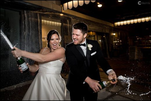 A bride and groom getting married at the Marriott Syracuse Downtown in Syracuse, NY