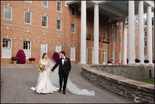 outdoor wedding photos in front of The Otesaga Resort Hotel in Cooperstown, NY